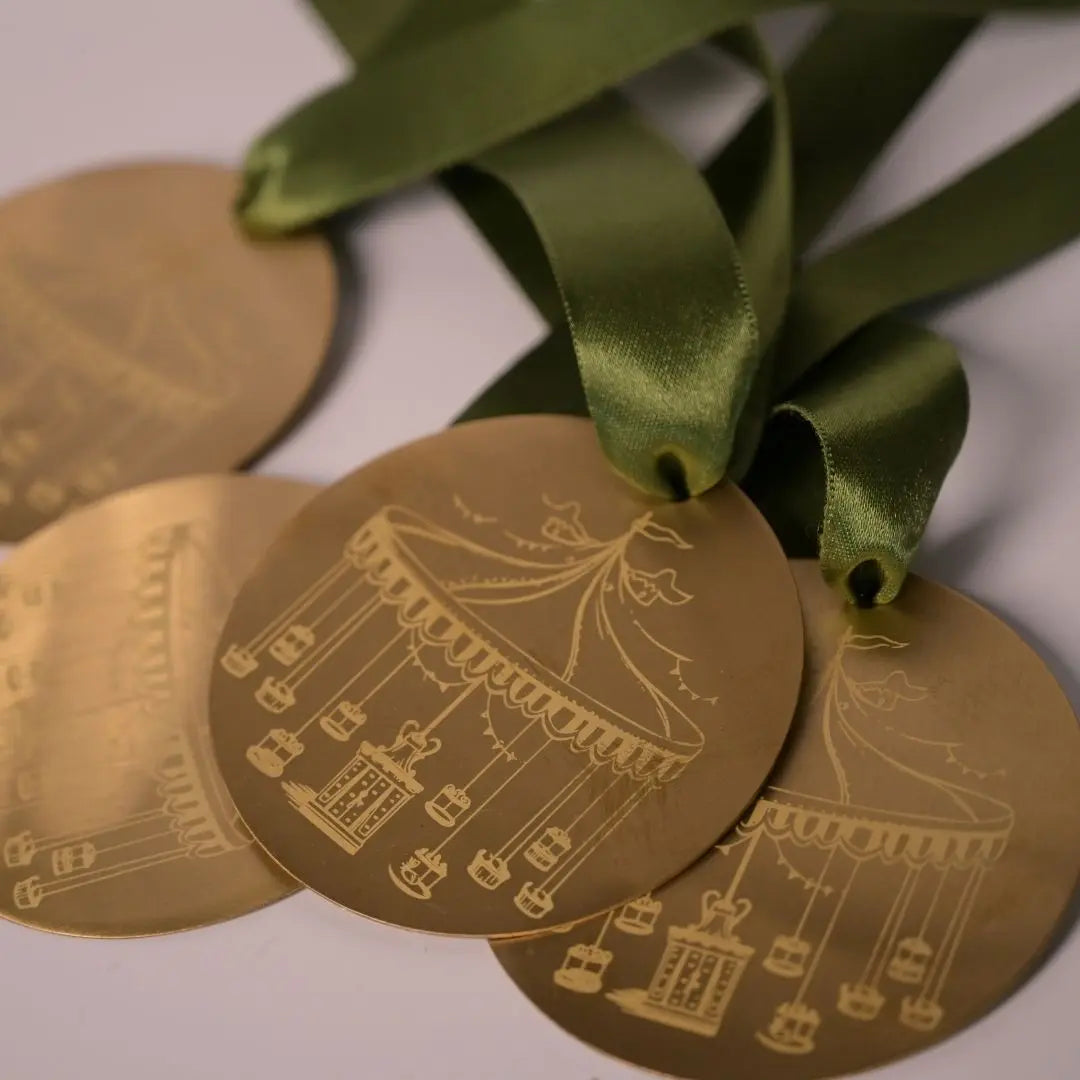 Brass Carousel Hanging Ornament – Laser-Etched Decor with Linen Yellow or Satin Green Ribbon | Luxury Christmas & Home Decor The confetti tree