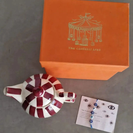 Luxury Rakhi Gift Hamper with Evil Eye Rakhi & Lumba, Handpainted Stoneware Teapot & Cup Set with Greeting Card | Premium Raksha Bandhan Gift Box for Bhai & Bhabhi The confetti tree