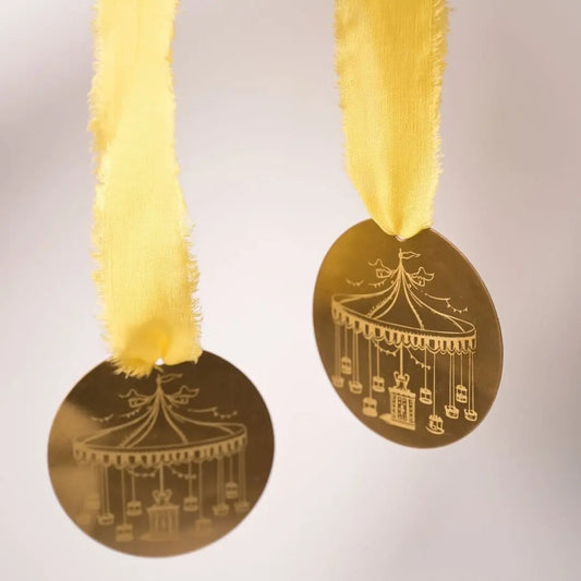 Brass Carousel Hanging Ornament – Laser-Etched Decor with Linen Yellow or Satin Green Ribbon | Luxury Christmas & Home Decor The confetti tree