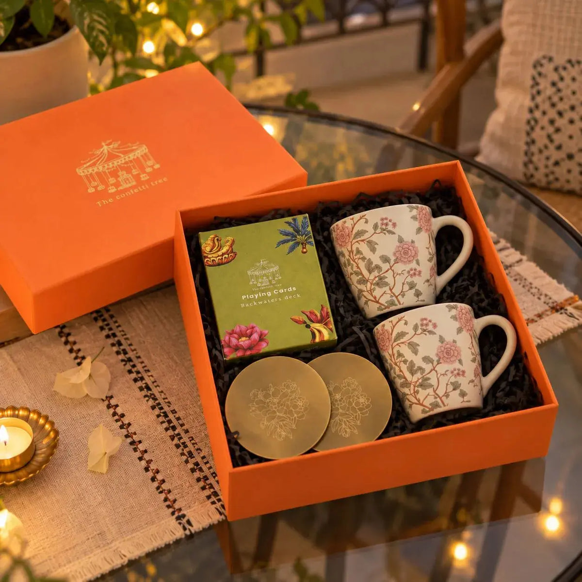 Diwali Gift Hamper with Floral Ceramic Mugs, Brass Coasters & Playing Cards | The Peony Garden Celebration Box The confetti tree
