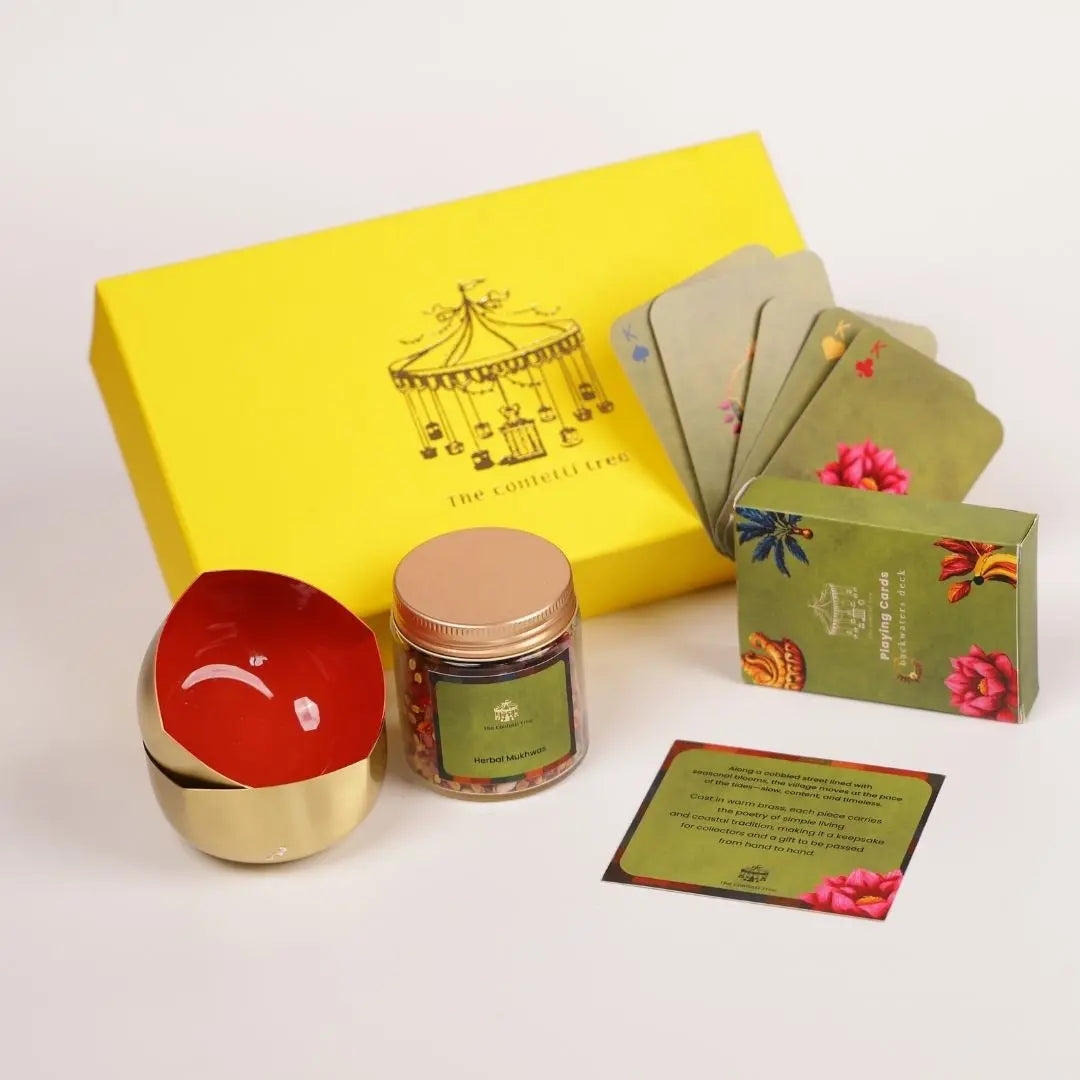 Diwali gift box - Brass diya set with playing cards and mukhwas The confetti tree