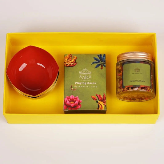 Diwali gift box - Brass diya set with playing cards and mukhwas The confetti tree