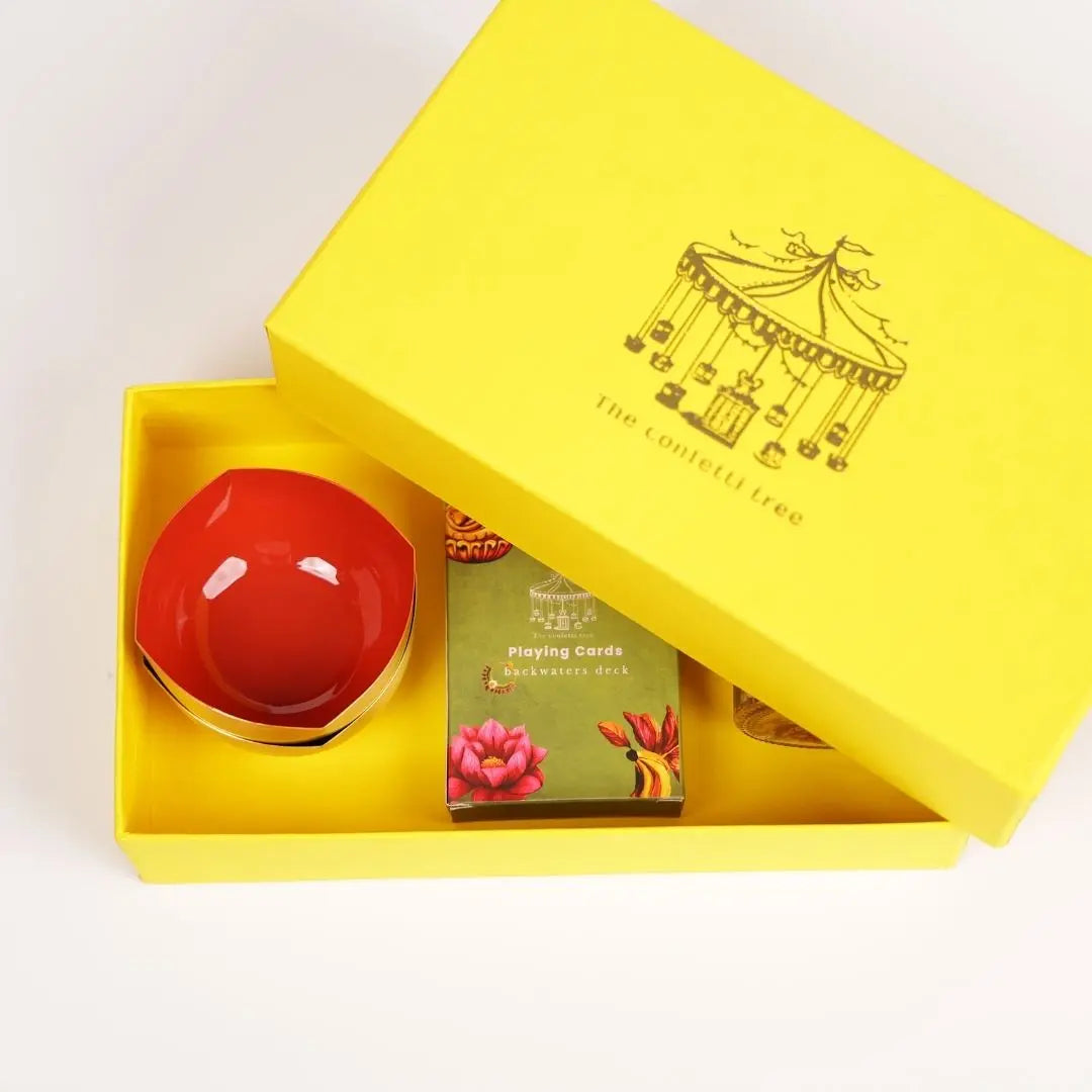 Diwali gift box - Brass diya set with playing cards and mukhwas The confetti tree