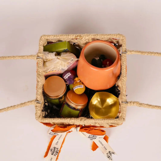 Eco-Friendly Growth Inspired Gift Hamper with Ceramic Planter, Brass Diyas, Seed Balls, Mukhwas & Dry Fruits, Plantable Crackers & Playing Cards The confetti tree
