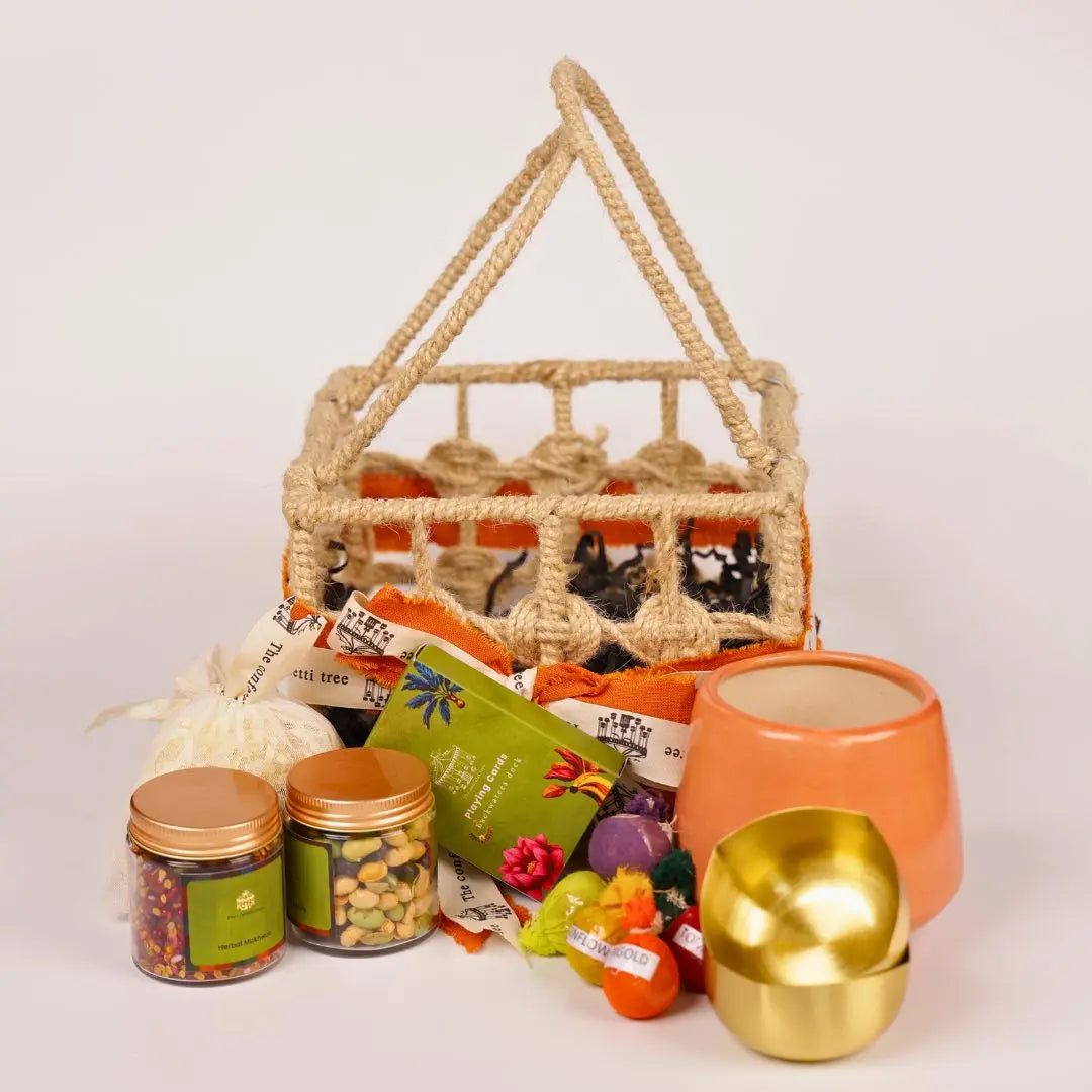 Eco-Friendly Growth Inspired Gift Hamper with Ceramic Planter, Brass Diyas, Seed Balls, Mukhwas & Dry Fruits, Plantable Crackers & Playing Cards The confetti tree