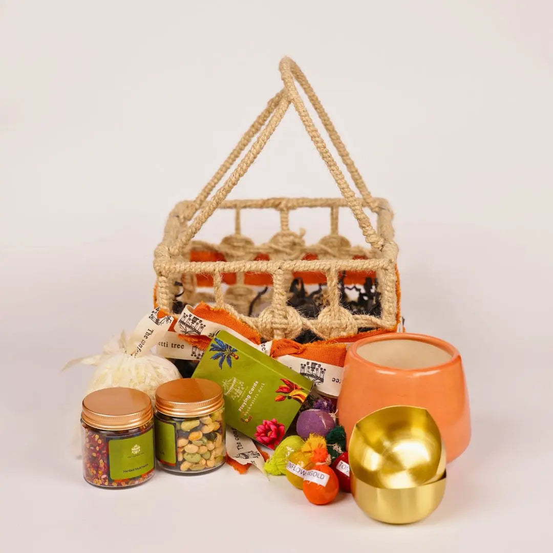 Eco-Friendly Growth Inspired Gift Hamper with Ceramic Planter, Brass Diyas, Seed Balls, Mukhwas & Dry Fruits, Plantable Crackers & Playing Cards The confetti tree