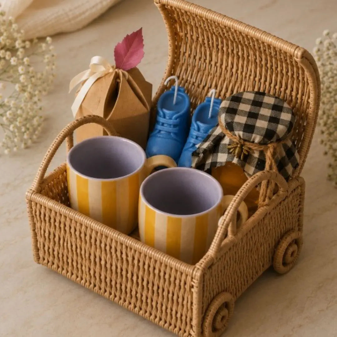 Luxury Baby Shower Gift Hamper with Car-Shaped Cane Basket, Set of 2 Ceramic Striped Mugs, Honey, Cookies & Baby Booties Candle Set | Premium Newborn Gift Basket The confetti tree