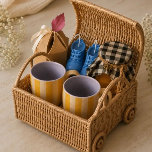 Luxury Baby Shower Gift Hamper with Car-Shaped Cane Basket, Set of 2 Ceramic Striped Mugs, Honey, Cookies & Baby Booties Candle Set | Premium Newborn Gift Basket The confetti tree