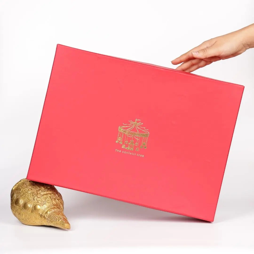 Luxury Diwali Gift Box with Brass Finish Platter, Soy Wax Candle, Dry Fruits, Mukhwas, Brass Tong & Designer Playing Cards The confetti tree