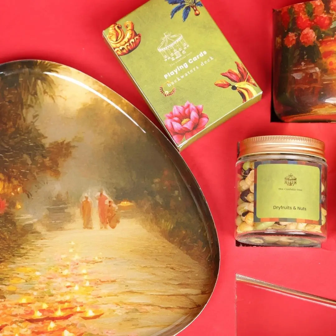 Luxury Diwali Gift Box with Brass Finish Platter, Soy Wax Candle, Dry Fruits, Mukhwas, Brass Tong & Designer Playing Cards The confetti tree