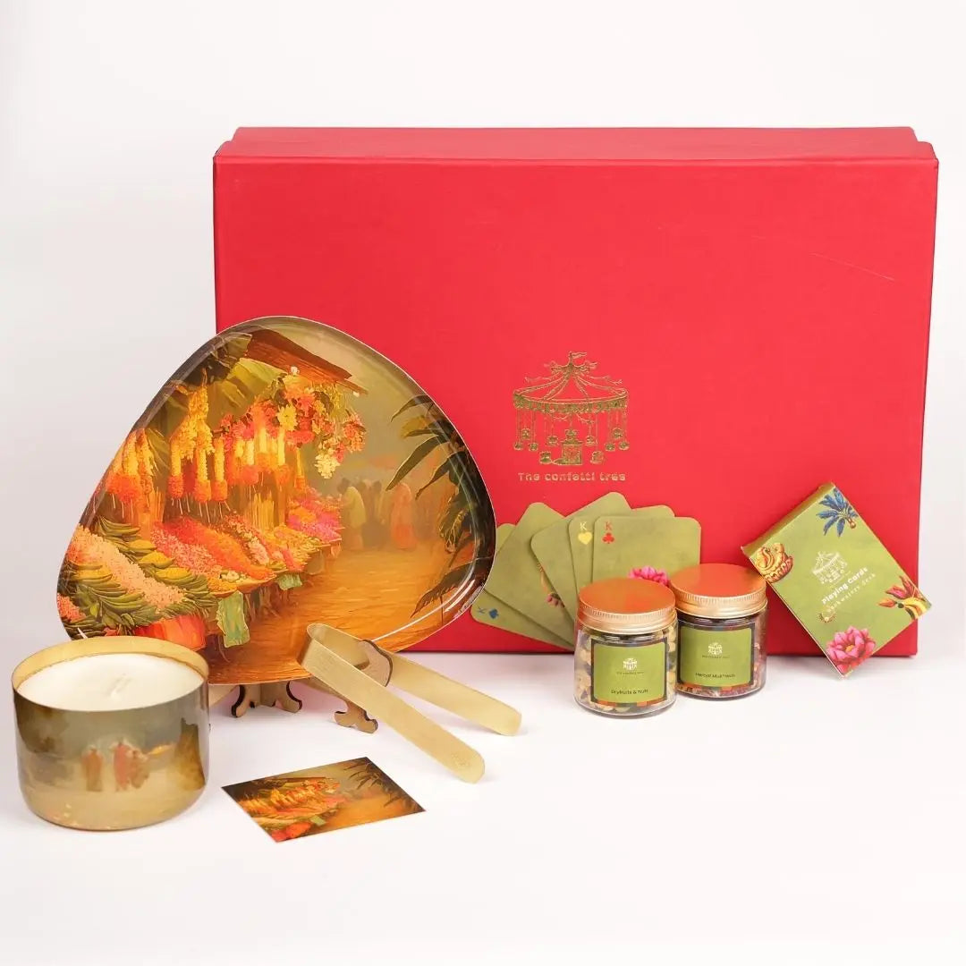 Luxury Diwali Gift Box with Brass Finish Platter, Soy Wax Candle, Dry Fruits, Mukhwas, Brass Tong & Designer Playing Cards The confetti tree