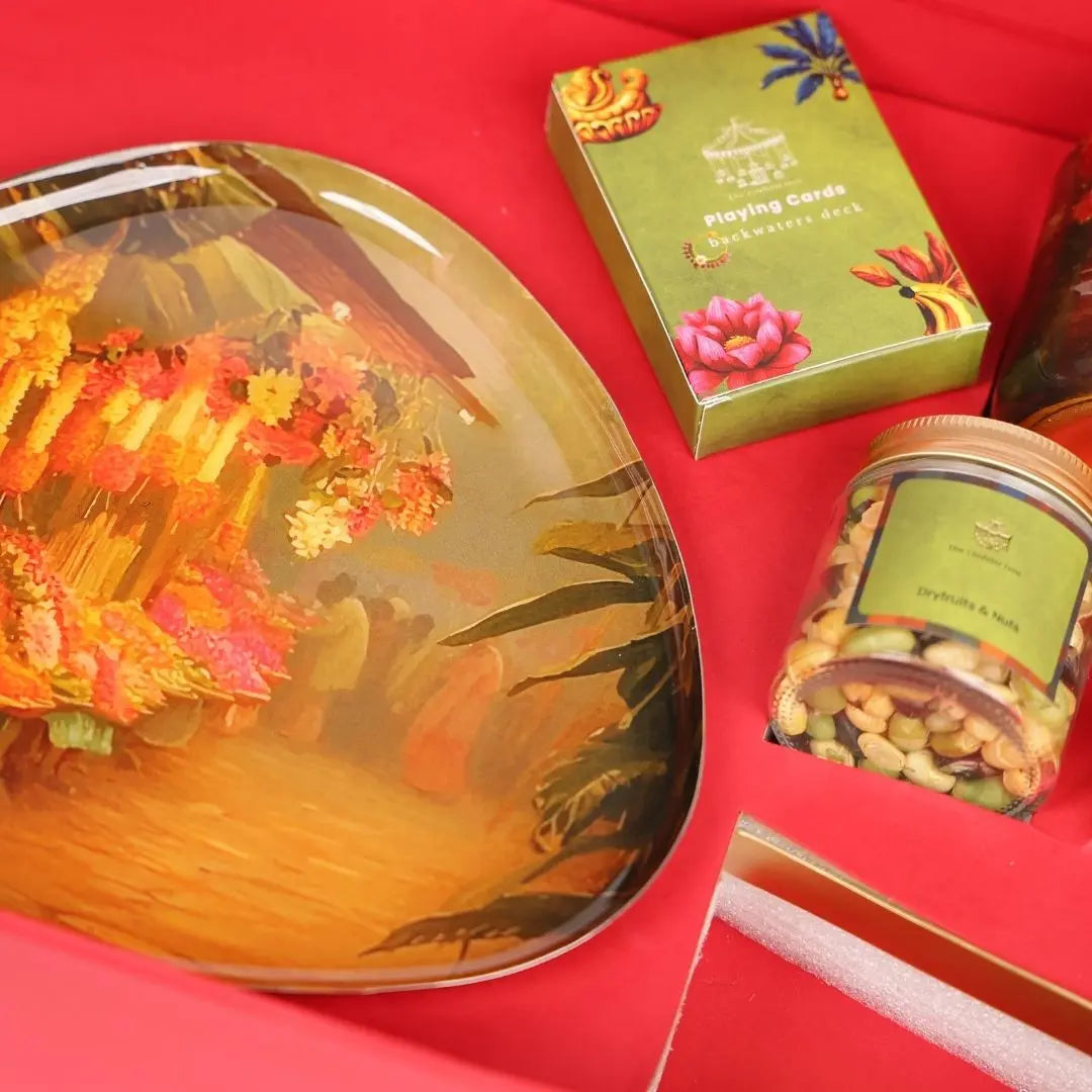 Luxury Diwali Gift Box with Brass Finish Platter, Soy Wax Candle, Dry Fruits, Mukhwas, Brass Tong & Designer Playing Cards The confetti tree