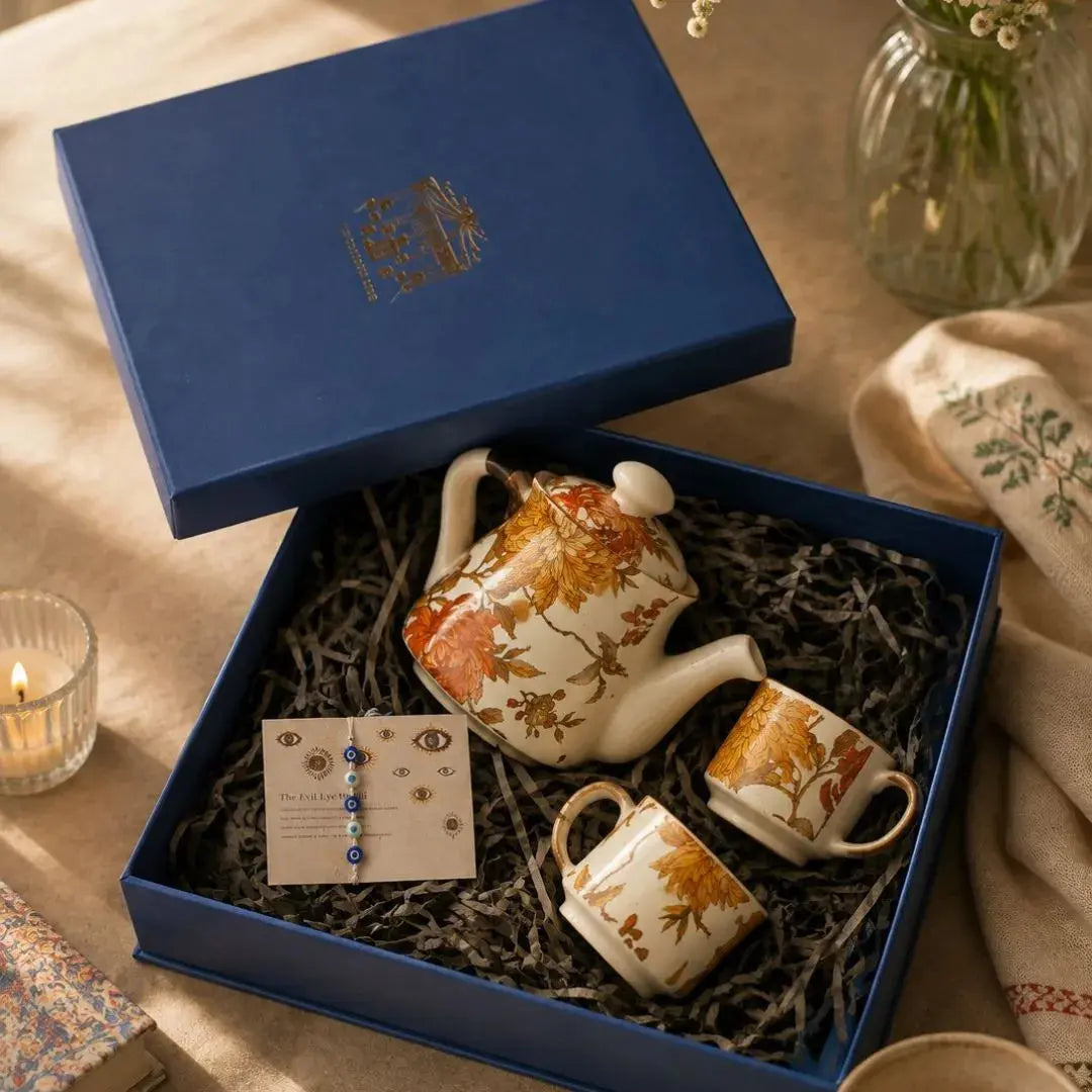 Luxury Floral Ceramic Tea Set Gift Box with Kettle, 2 Cups & Evil Eye Rakhi | Handmade Stoneware Tea Gift Hamper | Premium Raksha Bandhan Gift The confetti tree