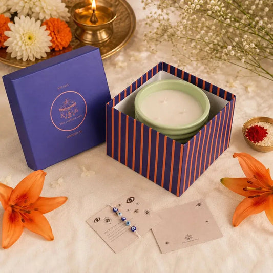 Luxury Rakhi Gift Box with Evil Eye Rakhi & Lumba, Ceramic Soy Wax Scented Candle & Greeting Card | Premium Raksha Bandhan Gift Hamper for Bhai & Bhabhi The confetti tree