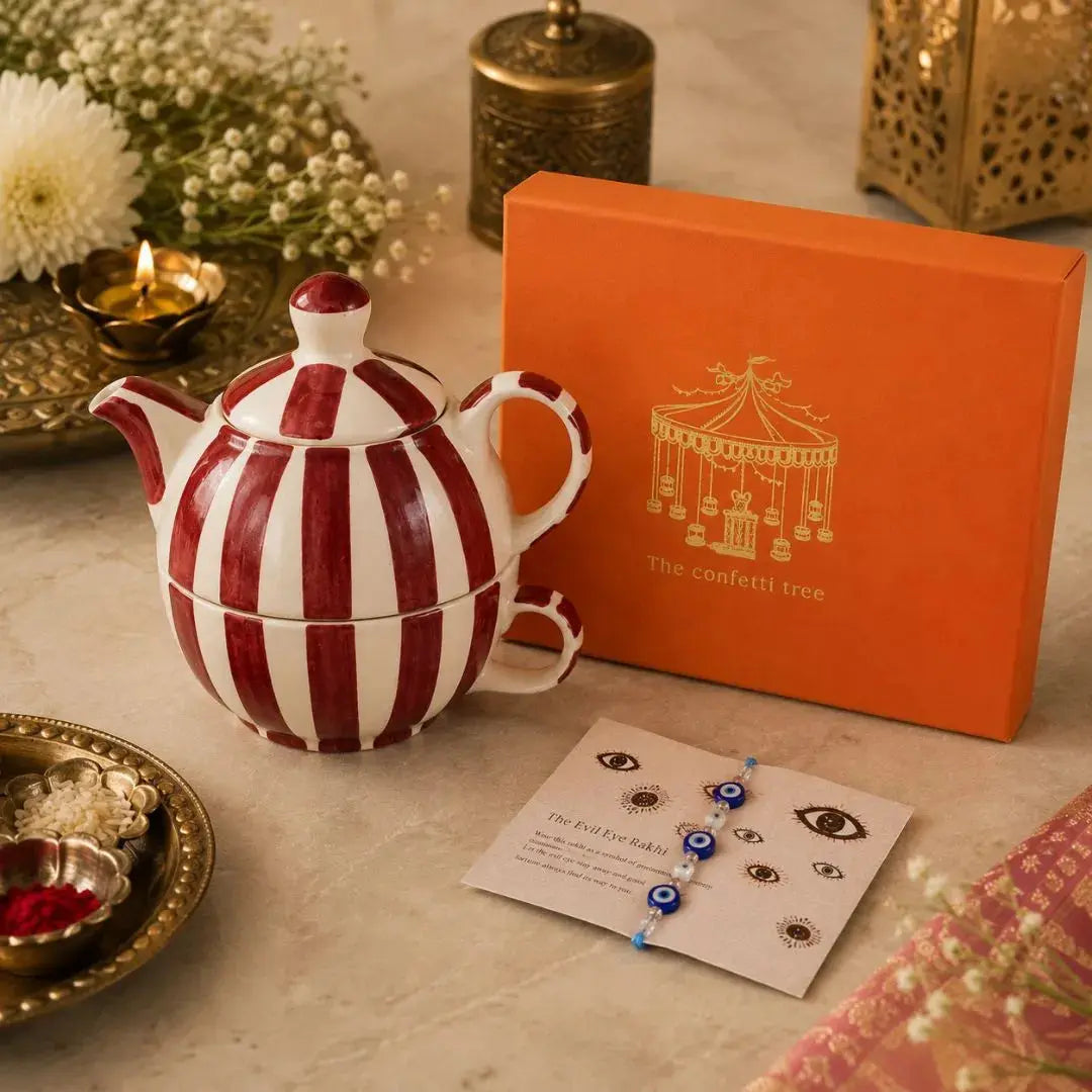Luxury Rakhi Gift Hamper with Evil Eye Rakhi & Lumba, Handpainted Stoneware Teapot & Cup Set with Greeting Card | Premium Raksha Bandhan Gift Box for Bhai & Bhabhi The confetti tree