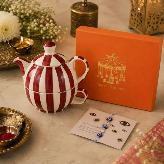 Luxury Rakhi Gift Hamper with Evil Eye Rakhi & Lumba, Handpainted Stoneware Teapot & Cup Set with Greeting Card | Premium Raksha Bandhan Gift Box for Bhai & Bhabhi The confetti tree