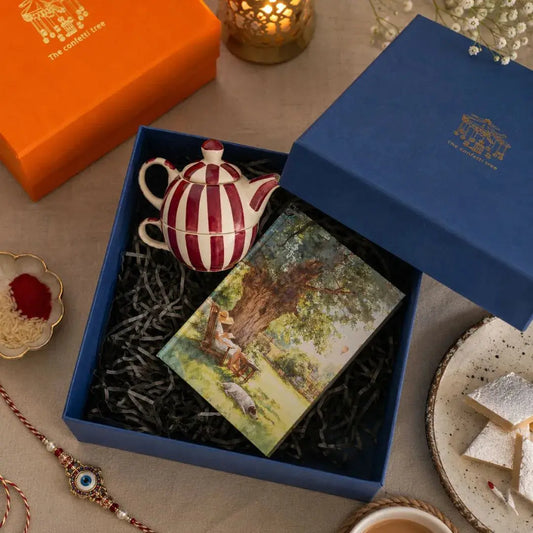 Luxury Rakhi Gift Hamper with Evil Eye Rakhi & Lumba, Handpainted Stoneware Teapot & Cup Set, Hardbound Lazy Day Musings Notebook & Greeting Card | Premium Raksha Bandhan Gift Box for Bhai & Bhabhi The confetti tree