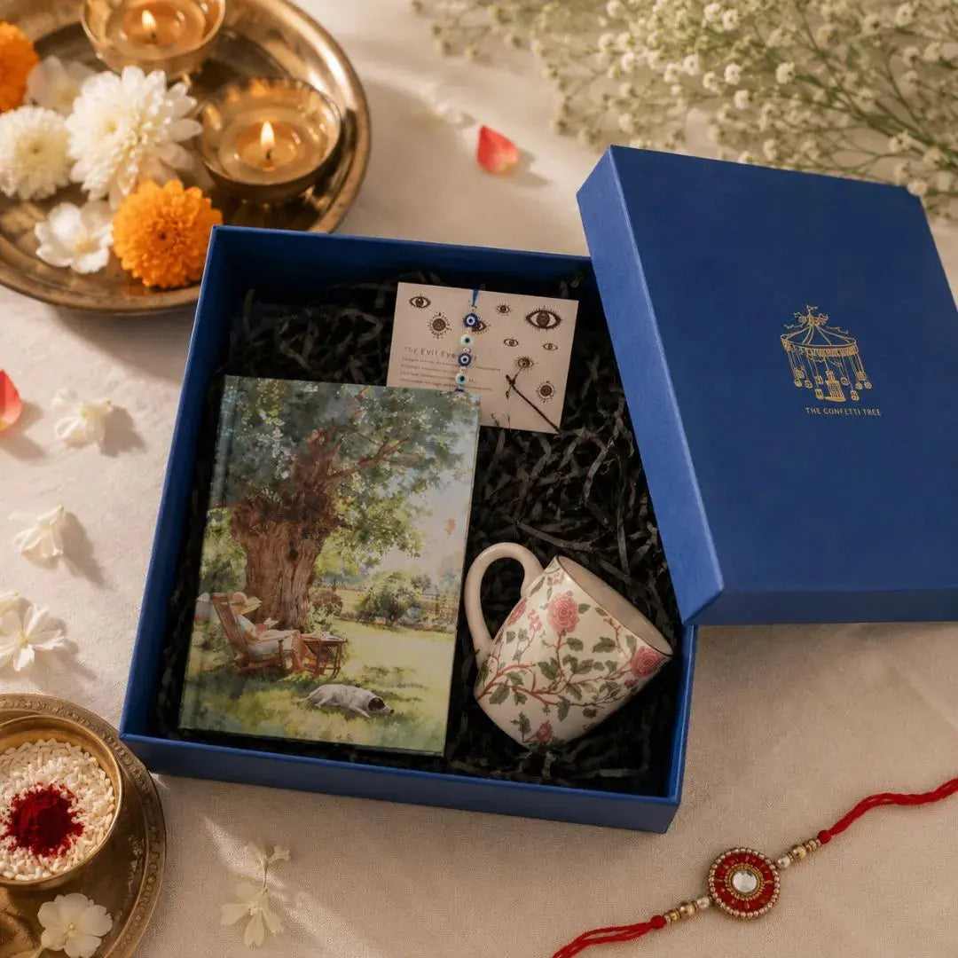 Luxury Rakhi Gift Hamper with Evil Eye Rakhi & Lumba, Hardbound Notebook, Ceramic Coffee Mug & Greeting Card | Premium Raksha Bandhan Gift Box for Bhai & Bhabhi The confetti tree