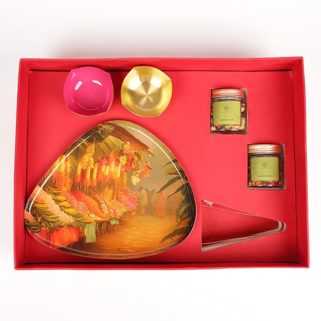 Premium Diwali Gift Box with Brass Finish Platter, Pure Brass Diyas, Brass Tong, Dry Fruits & Mukhwas The confetti tree