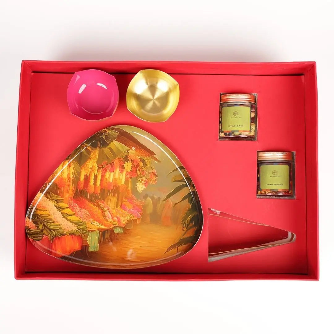 Premium Diwali Gift Box with Brass Finish Platter, Pure Brass Diyas, Brass Tong, Dry Fruits & Mukhwas The confetti tree