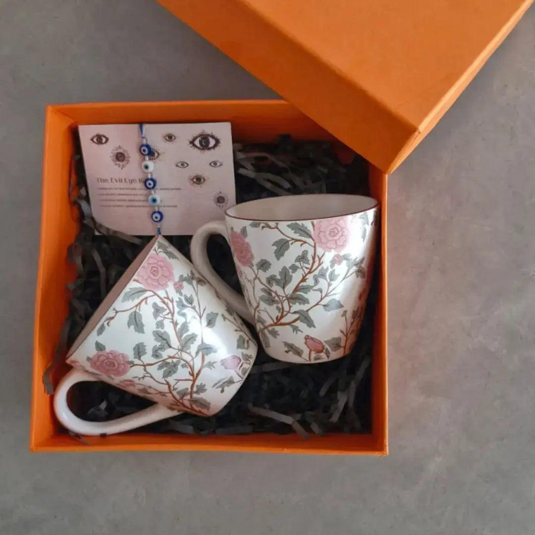 Premium Rakhi Gift Hamper with Evil Eye Rakhi & Lumba, Set of 2 Peony Ceramic Coffee Mugs & Greeting Card | Luxury Raksha Bandhan Gift Box for Bhai & Bhabhi The confetti tree