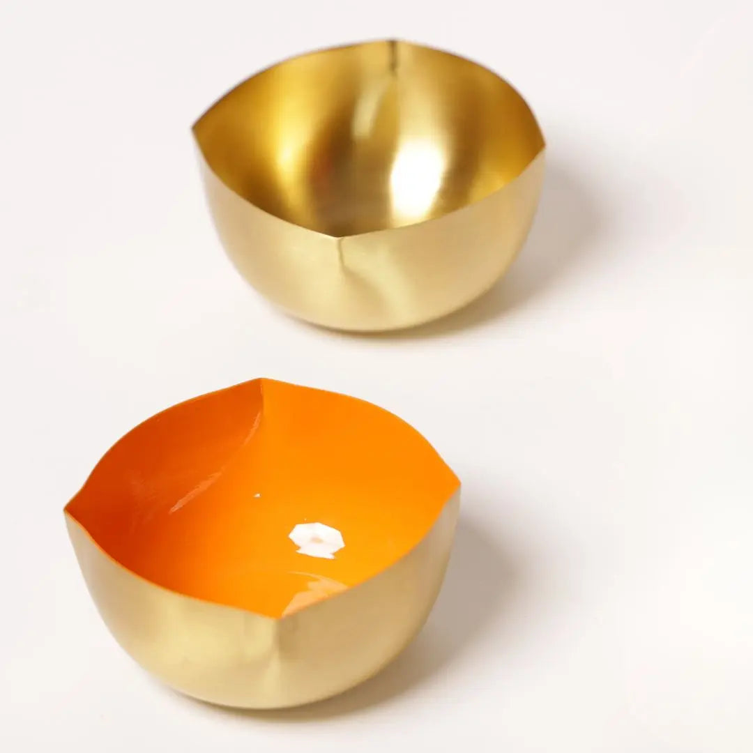 Pure Brass Diya with Orange Enamel – Matte Finish Handcrafted Oil Lamp for Pooja & Festive Décor The confetti tree