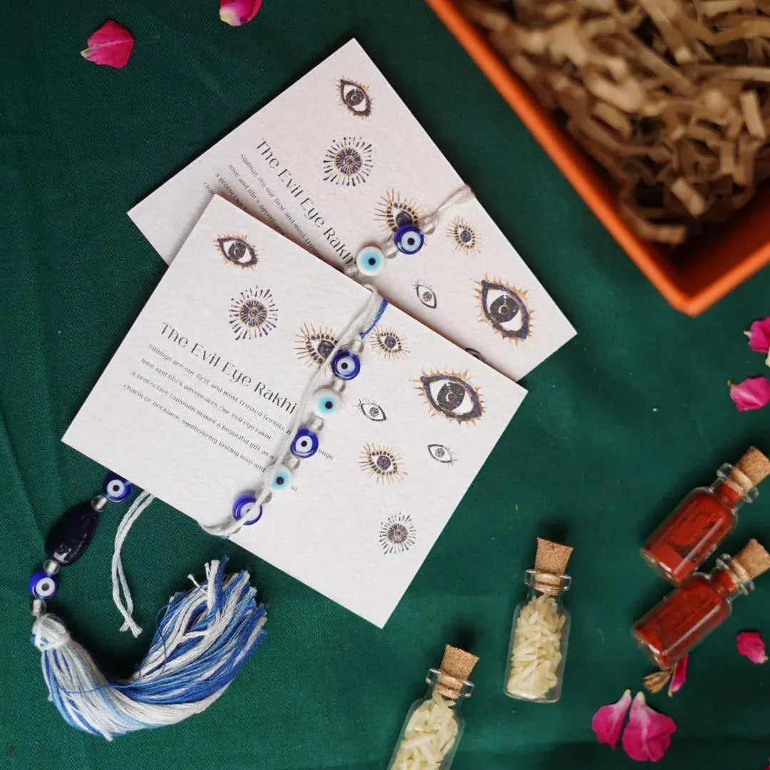 Rakhi Gift Box with Evil Eye Rakhi & Lumba Set, Soy Wax Scented Candle & Greeting Card | Premium Raksha Bandhan Gift Hamper for Bhai & Bhabhi The confetti tree