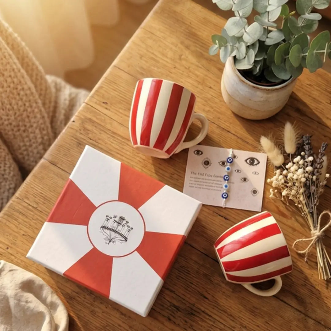 Rakhi Gift Hamper with Evil Eye Rakhi & Lumba & Set of 2 Handpainted Red Striped Vintage Tea Cups | Premium Raksha Bandhan Gift for Bhai Bhabhi The Confetti Tree