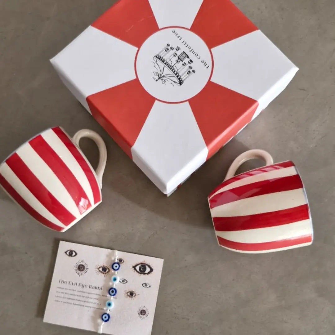 Rakhi Gift Hamper with Evil Eye Rakhi & Lumba & Set of 2 Handpainted Red Striped Vintage Tea Cups | Premium Raksha Bandhan Gift for Bhai Bhabhi The Confetti Tree