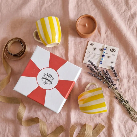 Rakhi Gift Hamper with Evil Eye Rakhi & Lumba & Set of 2 Handpainted Yellow Striped Vintage Tea Cups | Premium Raksha Bandhan Gift for Bhai Bhabhi The Confetti Tree
