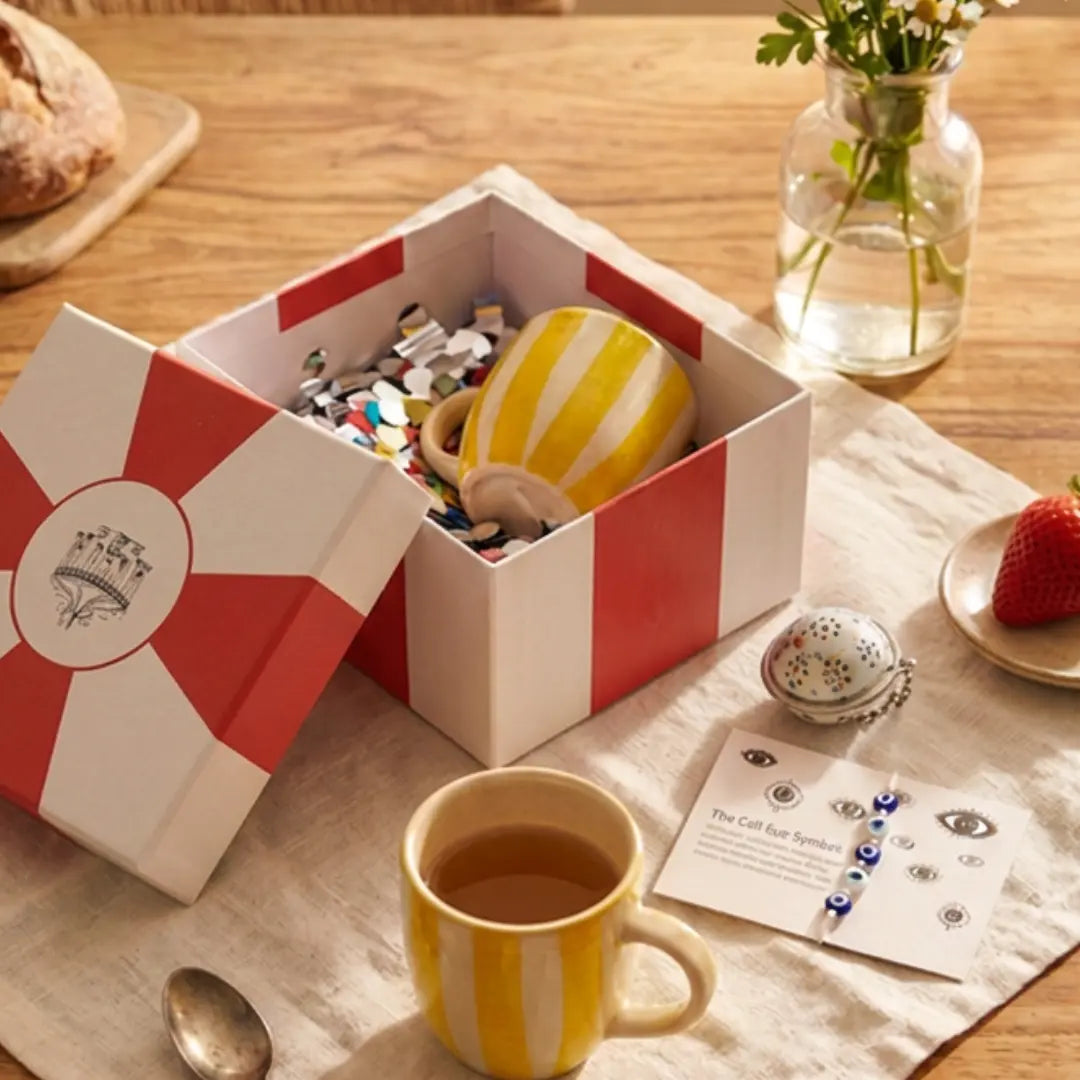 Rakhi Gift Hamper with Evil Eye Rakhi & Lumba & Set of 2 Handpainted Yellow Striped Vintage Tea Cups | Premium Raksha Bandhan Gift for Bhai Bhabhi The Confetti Tree