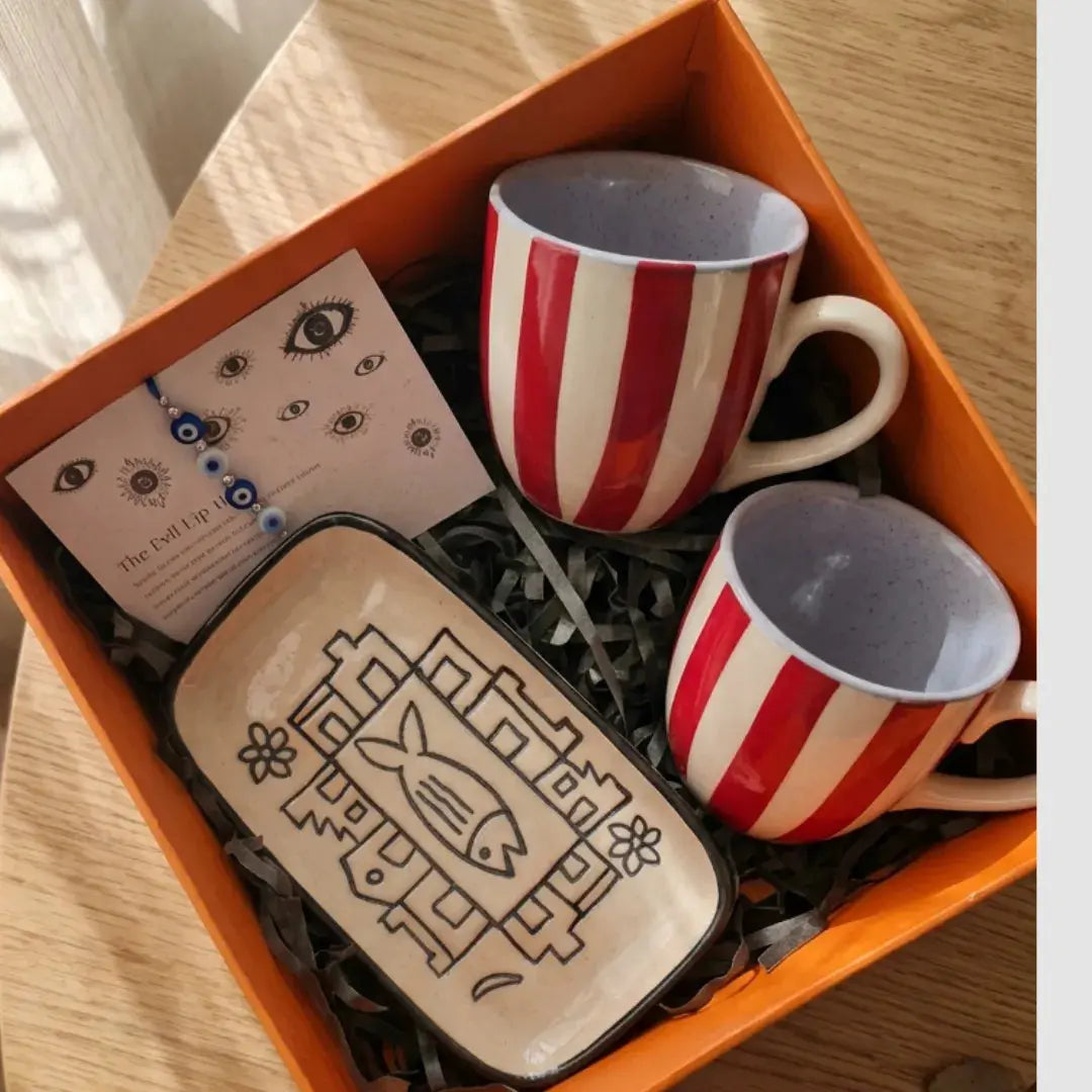 Rakhi Gift Hamper with Evil Eye Rakhi & Lumba, Set of 2 Handpainted Red Striped Tea Cups & Hand-Illustrated Trinket Tray | Premium Raksha Bandhan Gift for Bhai Bhabhi The Confetti Tree