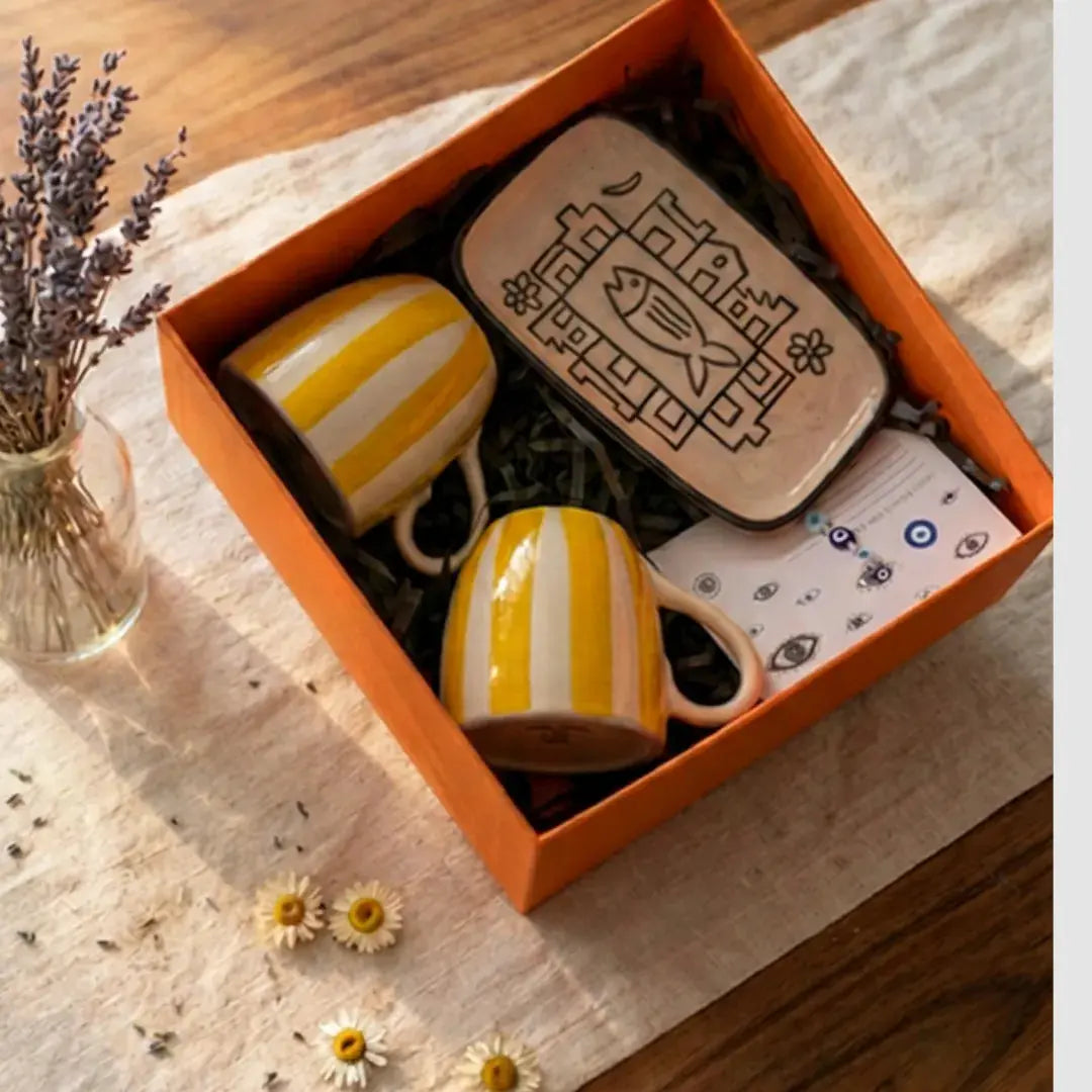 Rakhi Gift Hamper with Evil Eye Rakhi & Lumba, Set of 2 Handpainted Yellow Tea Cups & Hand-Illustrated Trinket Tray | Premium Raksha Bandhan Gift for Bhai Bhabhi The Confetti Tree