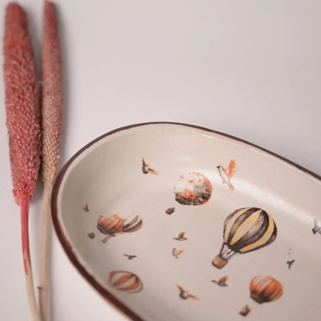 Stoneware Oval Tray with Hot Air Balloon Print & Brass Tong – Whimsical Serveware Set for Snacks, Cookies & Festive Gifting The confetti tree