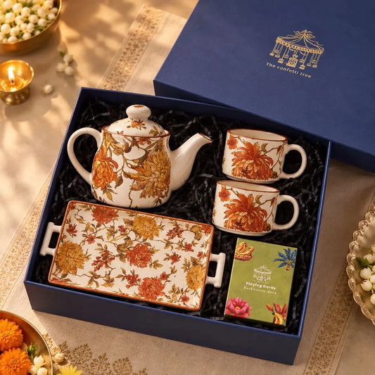 The Autumn Tea Affair Gift Hamper – Diwali Gift Box with Floral Ceramic Teapot, 2 Cups, Serving Tray & Playing Cards The confetti tree
