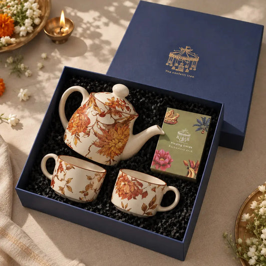 The Golden Hour Tea Hamper |  Diwali Gift Hamper with Floral Ceramic Teapot, 2 Tea Cups & Playing Cards The confetti tree